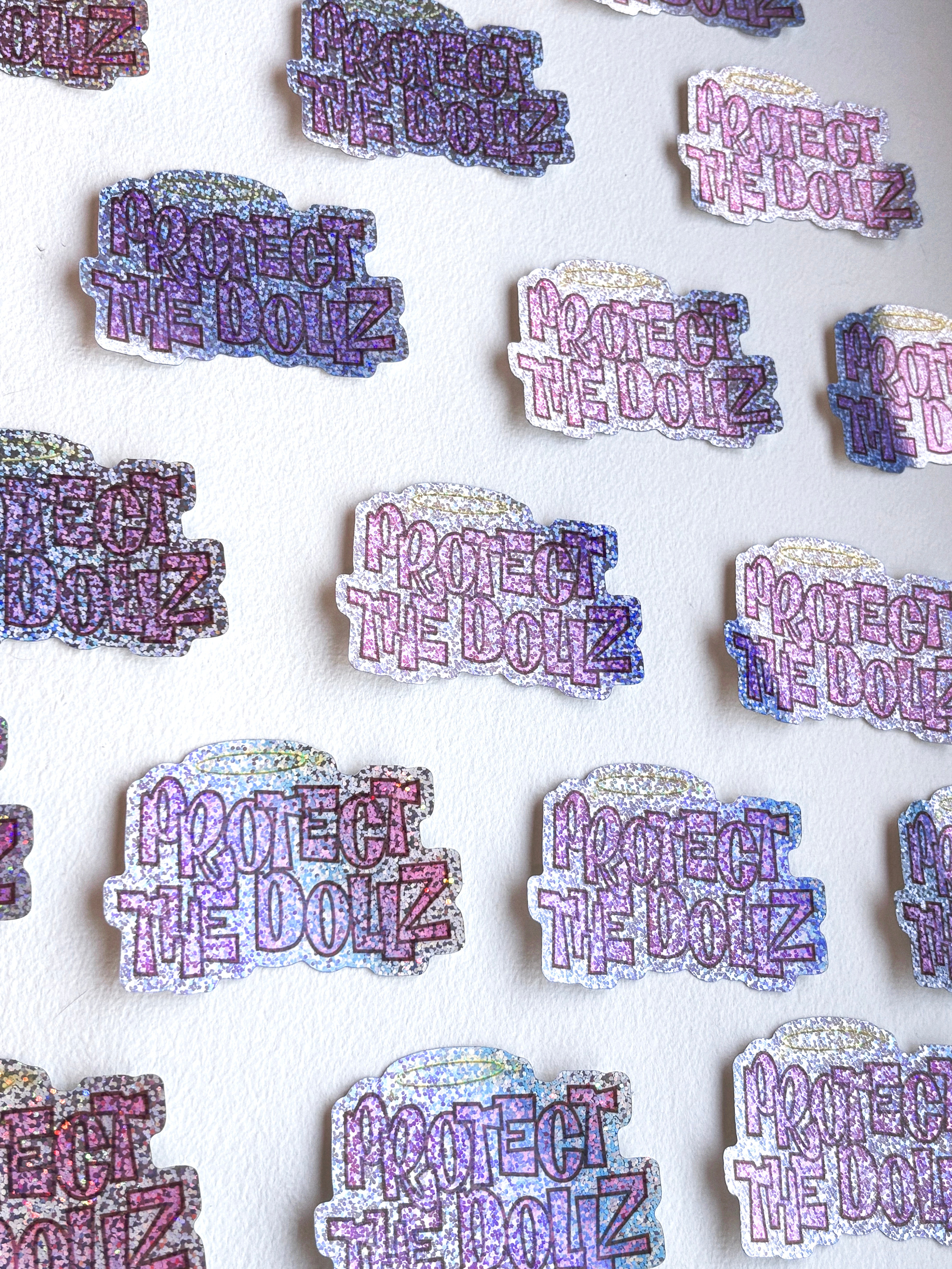 Protect The Dollz Glitter Sticker