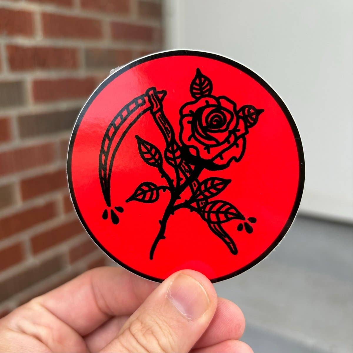 Scythe and rose sticker