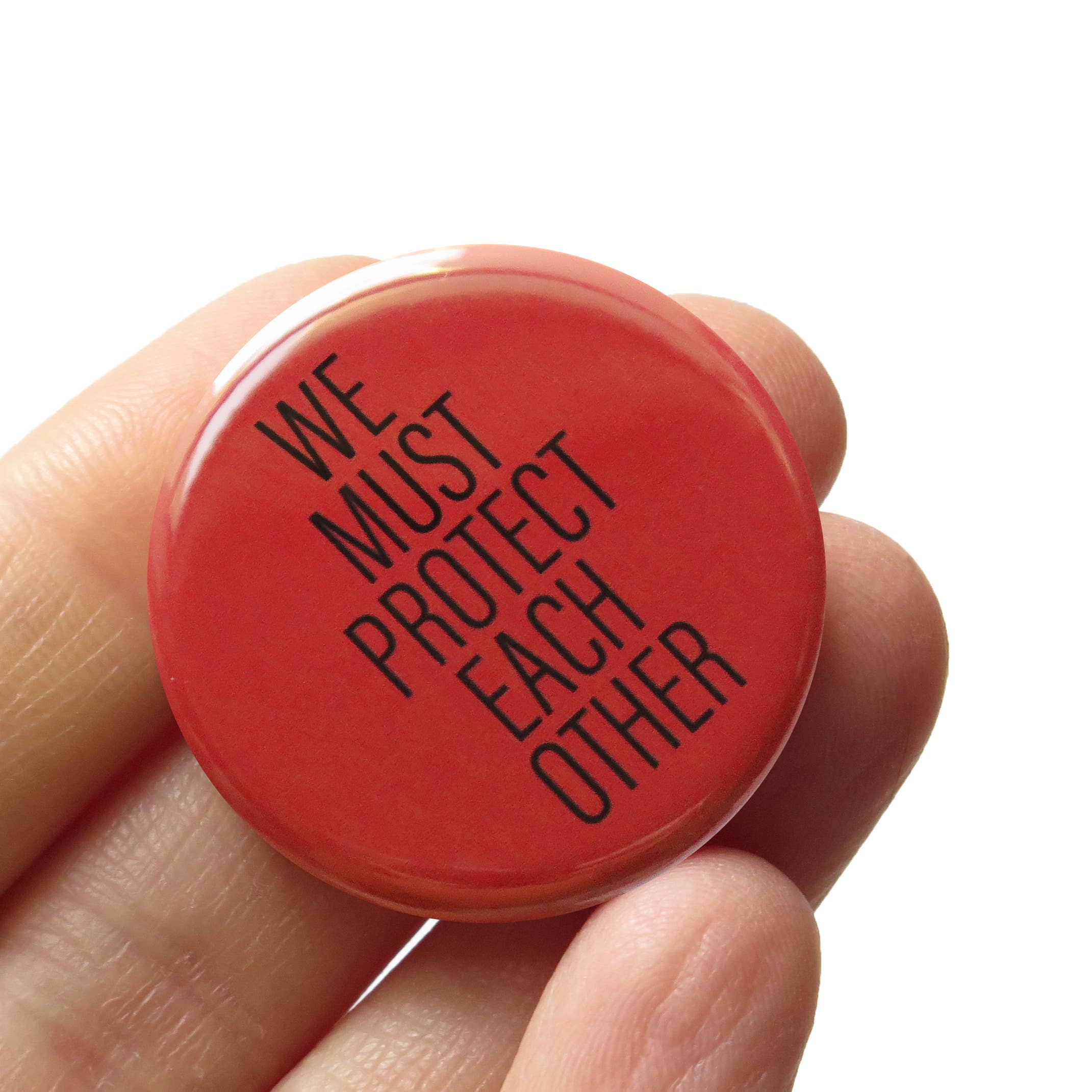 We Must Protect Each Other Pinback Button