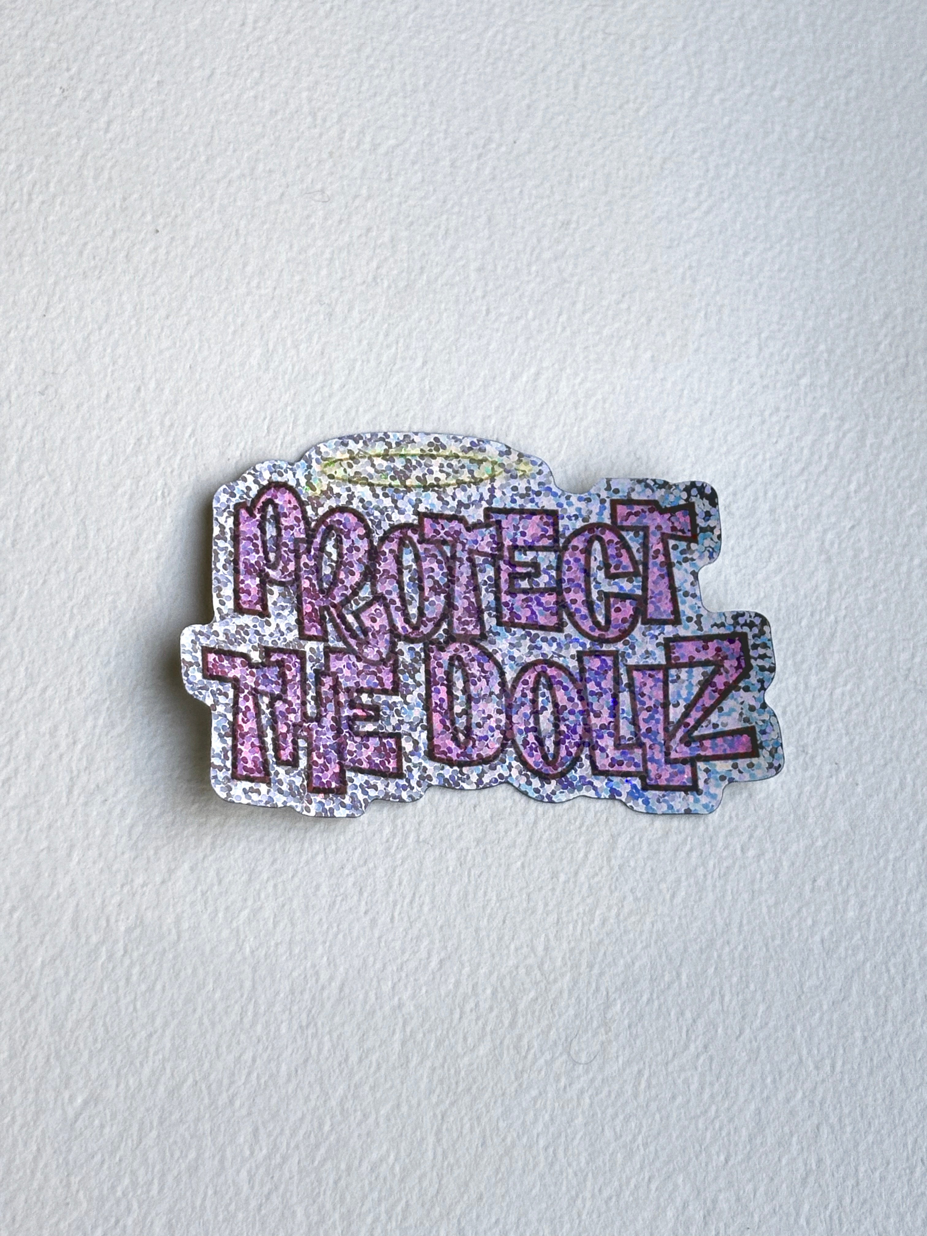Protect The Dollz Glitter Sticker